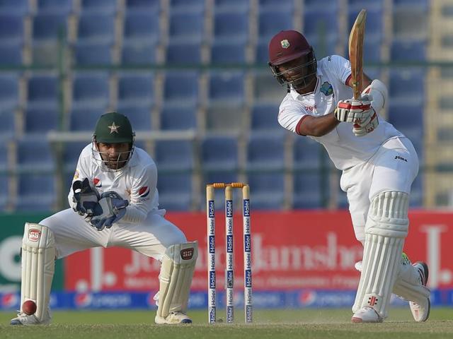 West Indies' batsman Kraigg Brathwaite (R) plays a shot as Pakistani wicketkeeper Sarfraz Ahmed looks on. (AFP Photo) West Indies' batsman Kraigg Brathwaite (R) plays a shot as Pakistani wicketkeeper Sarfraz Ahmed looks on. (AFP Photo)