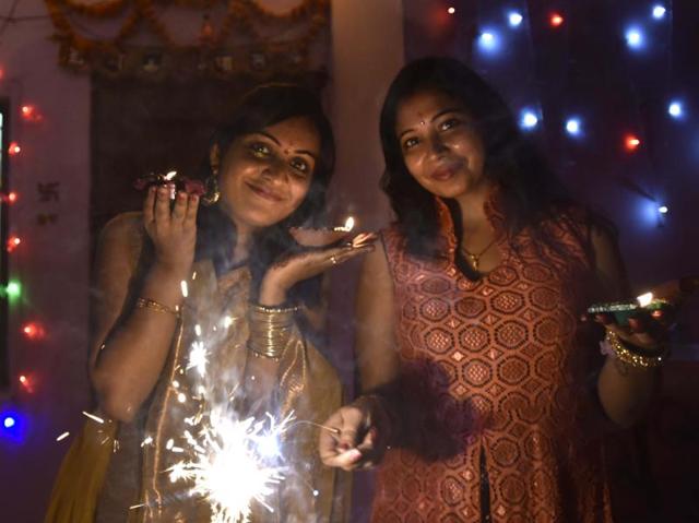 Residents celebrate Diwali with diyas and firecrackers, in New Delhi. (Arvind Yadav/HT Photo) Residents celebrate Diwali with diyas and firecrackers, in New Delhi. (Arvind Yadav/HT Photo)