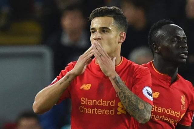 Liverpool's Brazilian midfielder Philippe Coutinho (L) celebrates scoring their second goal. (AFP Photo)