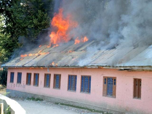 A government higher secondary school on fire in Srinagar on September 10, 2016. Twenty-five schools have been completely or partially burnt down in the last three months.(Kashmir Life) A government higher secondary school on fire in Srinagar on September 10, 2016. Twenty-five schools have been completely or partially burnt down in the last three months.(Kashmir Life)