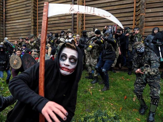 And here comes Grim Reaper, Zombie and Joker mashup from the Zombie Walk parade during Halloween celebrations in Kiev, Ukraine on October 30, 2016. (REUTERS) And here comes Grim Reaper, Zombie and Joker mashup from the Zombie Walk parade during Halloween celebrations in Kiev, Ukraine on October 30, 2016. (REUTERS)
