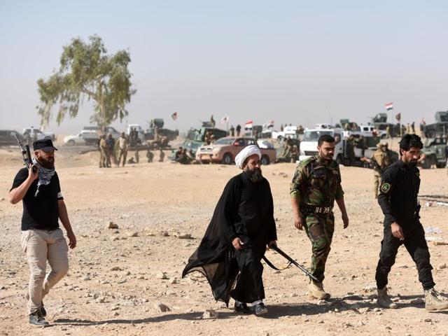 Members of al-Hashd Shaabi, a Shia militia trained by Iran, on the frontlines near Mosul (AFP FILE) Members of al-Hashd Shaabi, a Shia militia trained by Iran, on the frontlines near Mosul (AFP FILE)
