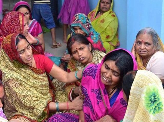 Women console Central Jail head-constable (inset) Ramashankar Yadav’s wife who was killed by SIMI operatives on Monday in Bhopal. (PTI Photo) Women console Central Jail head-constable (inset) Ramashankar Yadav’s wife who was killed by SIMI operatives on Monday in Bhopal. (PTI Photo)