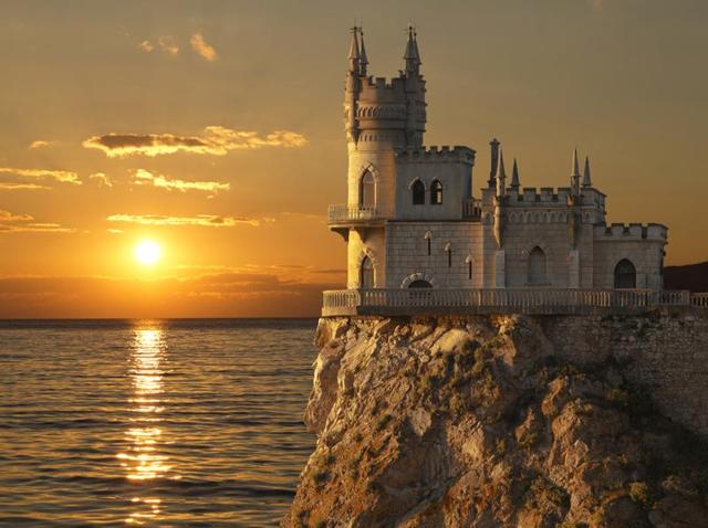 Swallow’s Nest castle on the rock over the Black Sea at sunset. It is a decorative castle located at Gaspra, a small spa town between Yalta and Alupka, in Crimea. (Shutterstock) Swallow’s Nest castle on the rock over the Black Sea at sunset. It is a decorative castle located at Gaspra, a small spa town between Yalta and Alupka, in Crimea. (Shutterstock)