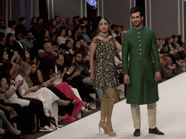 Models present creation of a designer Maheen Karim. (AP) Models present creation of a designer Maheen Karim. (AP)