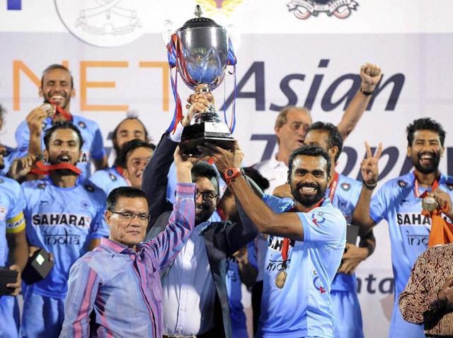 India’s hockey team poses with the Asian Champions Trophy on their return to Delhi on Monday. (PTI) India’s hockey team poses with the Asian Champions Trophy on their return to Delhi on Monday. (PTI)