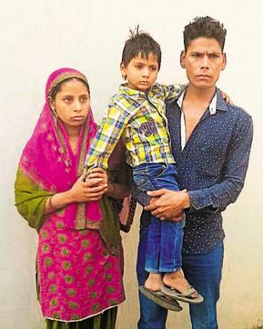 The five-year-old boy with his parents after being rescued from the clutches of kidnappers on Monday in Jalandhar. (HT Photo) The five-year-old boy with his parents after being rescued from the clutches of kidnappers on Monday in Jalandhar. (HT Photo)