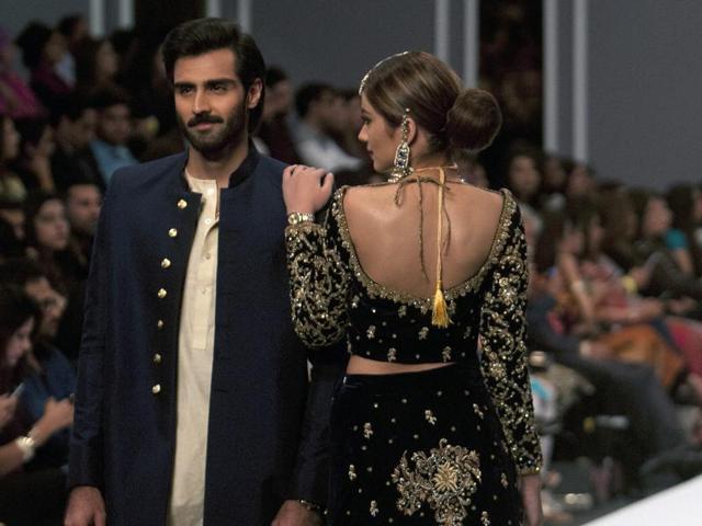 Models present creation of a designer Maheen Karim during the opening day. (AP) Models present creation of a designer Maheen Karim during the opening day. (AP)