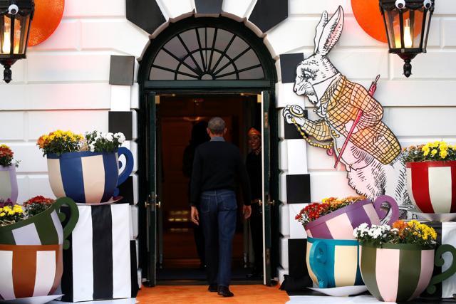 US President Barack Obama departs after giving out Halloween treats to children from the South Portico of the White House in Washington, US. (Reuters Photo) 