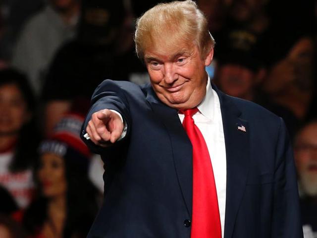 Republican presidential candidate Donald Trump acknowledges a crowd before speaking at the Macomb Community College in Warren, Michigan, on Monday . (AP) Republican presidential candidate Donald Trump acknowledges a crowd before speaking at the Macomb Community College in Warren, Michigan, on Monday . (AP)