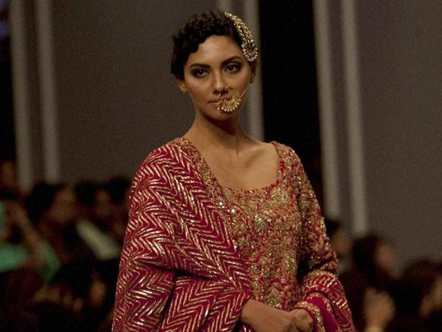 A model presents a creation from designer Nida Azwer. (AP) A model presents a creation from designer Nida Azwer. (AP)