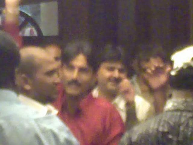 A TV grab shows Chhota Rajan aides Sunil Poddar (in red shirt) and Farid Tanasha (behind Poddar) at a party in a Chembur club. (HT FILE) A TV grab shows Chhota Rajan aides Sunil Poddar (in red shirt) and Farid Tanasha (behind Poddar) at a party in a Chembur club. (HT FILE)