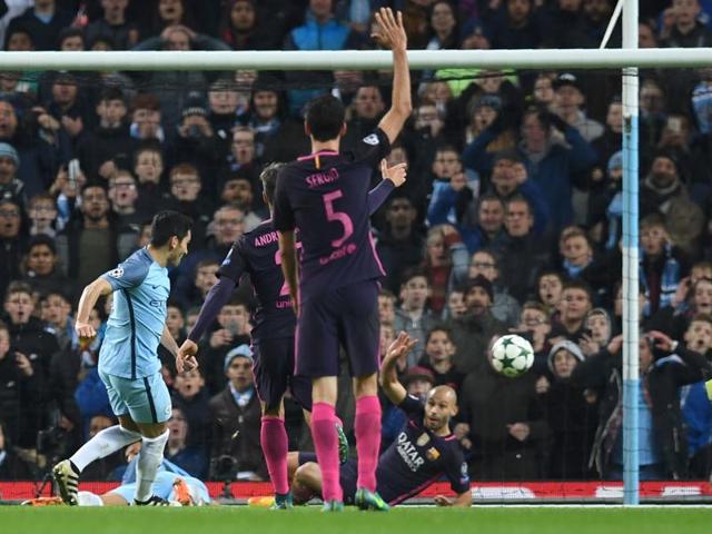 Manchester City's Ilkay Gundogan (L) scores his team's third goal. (AFP) 