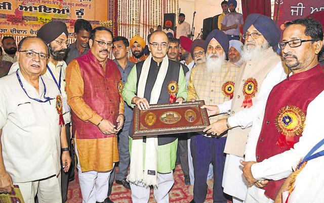 Punjab chief minister Parkash Singh Badal (2R) honouring Union finance minister Arun Jaitley (C) in presence of (from R) Punjab local bodies minister Anil Joshi, Chief Khalsa Diwan Charitable Society president Charanjit Singh Chadha, Rajya Sabha member Shwait Malik (2L) and Amritsar mayor Bakshi Ram Aora during the golden jubilee celebrations of Punjabi Suba and Sri Guru Harkrishan Public School, GT Road, and 114th foundation day of the Sikh organisation on Tuesday. (HT Photo) Punjab chief minister Parkash Singh Badal (2R) honouring Union finance minister Arun Jaitley (C) in presence of (from R) Punjab local bodies minister Anil Joshi, Chief Khalsa Diwan Charitable Society president Charanjit Singh Chadha, Rajya Sabha member Shwait Malik (2L) and Amritsar mayor Bakshi Ram Aora during the golden jubilee celebrations of Punjabi Suba and Sri Guru Harkrishan Public School, GT Road, and 114th foundation day of the Sikh organisation on Tuesday. (HT Photo)