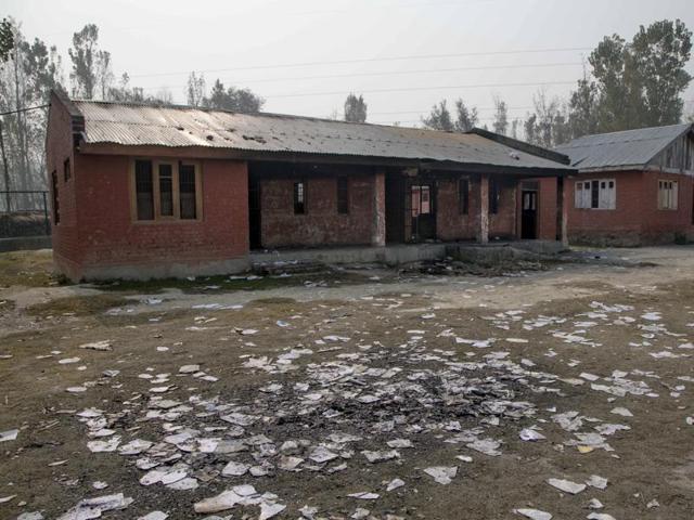 Destroyed books sit in the yard of a partially burned government high school in Goripora, outskirts of Srinagar, Kashmir on Tuesday. (AP) Destroyed books sit in the yard of a partially burned government high school in Goripora, outskirts of Srinagar, Kashmir on Tuesday. (AP)