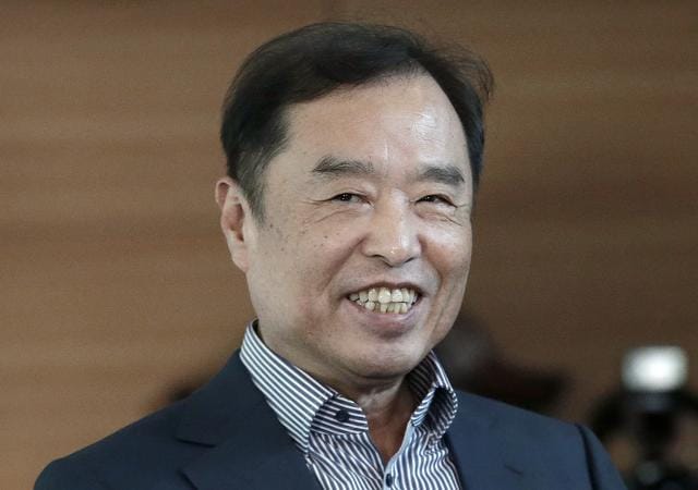 Kim Byong-joon, who was nominated prime minister by South Korean President Park Geun-hye, smiles as he arrives at his office in Seoul, South Korea on Wednesday. (AP Photo)