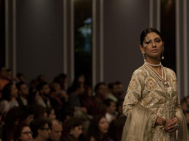 A model presents creation of a designer Nauman Arfeen. (AP) A model presents creation of a designer Nauman Arfeen. (AP)