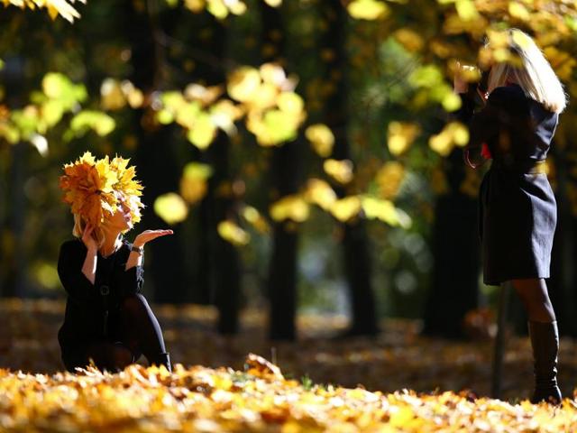 Women enjoy a sunny autumn day in central park in Minsk, Belarus October 13, 2016. (REUTERS/Vasily Fedosenko)