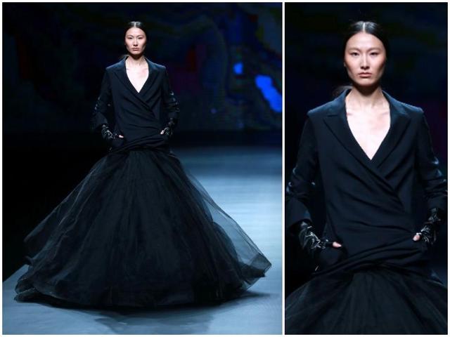 A model parades a creation from AM.IXAM Collection designed by Ying Ma at China Fashion Week in Beijing on Tuesday. This dark bride/bridesmaid blazer combo is perfect for a very, very cool wedding. (AFP) A model parades a creation from AM.IXAM Collection designed by Ying Ma at China Fashion Week in Beijing on Tuesday. This dark bride/bridesmaid blazer combo is perfect for a very, very cool wedding. (AFP)