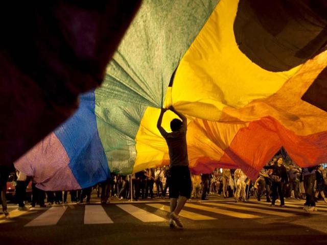 A participant holds up a rainbow banner at Argentina’s annual gay pride parade in Buenos Aires. (AP File Photo) A participant holds up a rainbow banner at Argentina’s annual gay pride parade in Buenos Aires. (AP File Photo)