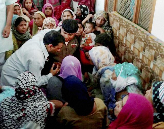 Delhi CM Arvind Kejriwal meets the family of ex-serviceman Ram Kishan Grewal at Bamla village. (PTI) Delhi CM Arvind Kejriwal meets the family of ex-serviceman Ram Kishan Grewal at Bamla village. (PTI)