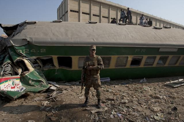 People look for victims in the wreckage of the trains in Karachi, Pakistan. (AP) People look for victims in the wreckage of the trains in Karachi, Pakistan. (AP)