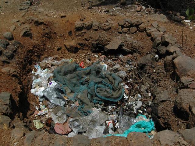 Biomedical waste disposed of in a pit.(HT FILE PHOTO) Biomedical waste disposed of in a pit.(HT FILE PHOTO)
