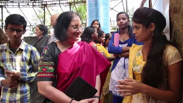 A young girl from Kalyanputi explains gender roles to Miranda House Principal Pratibha Jolly. A young girl from Kalyanputi explains gender roles to Miranda House Principal Pratibha Jolly.