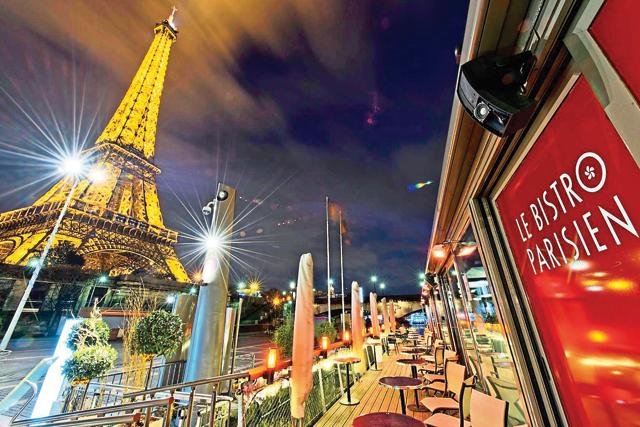 Le Bistro Parisien lies at the foot of the Eiffel Tower and alongside River Seine (Sathya Saran) Le Bistro Parisien lies at the foot of the Eiffel Tower and alongside River Seine (Sathya Saran)