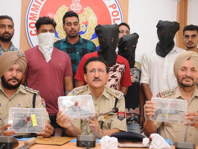 Police officials displaying recovered pistols during press conference in Jalandhar on Thursday. (Pradeep Pandit/HT Photo) Police officials displaying recovered pistols during press conference in Jalandhar on Thursday. (Pradeep Pandit/HT Photo)