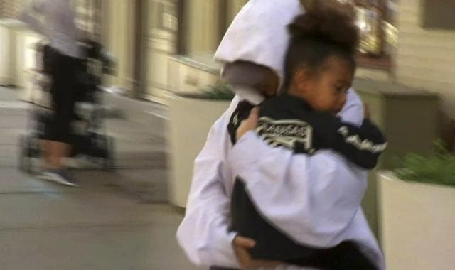 Kim Kardashian West carries her daughter North West to an awaiting vehicle, Thursday, October 6, 2016, in New York. (AP) Kim Kardashian West carries her daughter North West to an awaiting vehicle, Thursday, October 6, 2016, in New York. (AP)