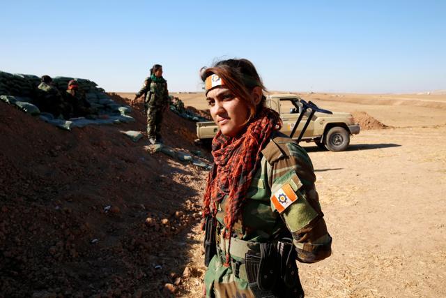 An Iranian-Kurdish female fighter is seen during a battle with Islamic State militants in Bashiqa, near Mosul. (REUTERS) An Iranian-Kurdish female fighter is seen during a battle with Islamic State militants in Bashiqa, near Mosul. (REUTERS)