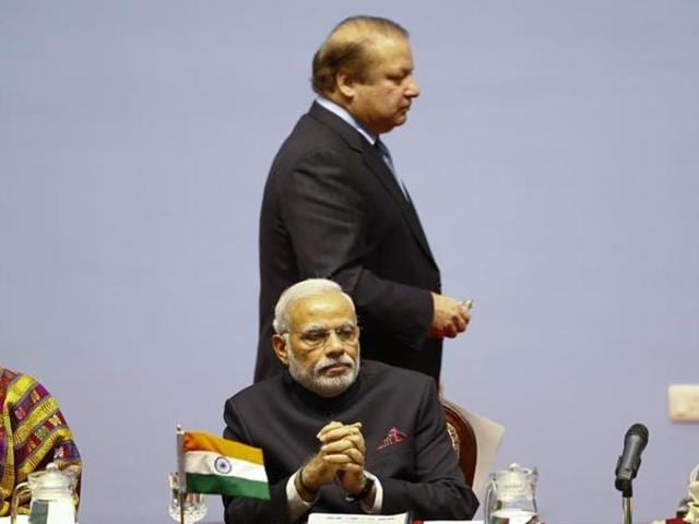 File photo of Pakistan Prime Minister Nawaz Sharif walking past Indian Prime Minister Narendra Modi. (Reuters File Photo) File photo of Pakistan Prime Minister Nawaz Sharif walking past Indian Prime Minister Narendra Modi. (Reuters File Photo)