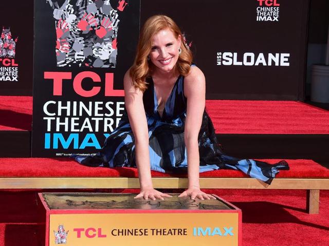 Jessica Chastain followed her idol Elizabeth Taylor in sinking her hands and feet into cement Thursday at Hollywood’s TCL Chinese Theatre, marking a career that has brought two Oscar nominations. (AFP) Jessica Chastain followed her idol Elizabeth Taylor in sinking her hands and feet into cement Thursday at Hollywood’s TCL Chinese Theatre, marking a career that has brought two Oscar nominations. (AFP)