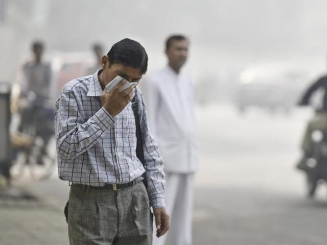 A man covers his face with a handkerchief in a feeble attempt to protect against the pollution. Masks with air filters are recommended for people who are susceptible to wheezing or other health conditions that get aggravated due to the bad air quality. (Raj K Raj/HT PHOTO) A man covers his face with a handkerchief in a feeble attempt to protect against the pollution. Masks with air filters are recommended for people who are susceptible to wheezing or other health conditions that get aggravated due to the bad air quality. (Raj K Raj/HT PHOTO)