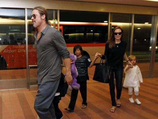 Hollywood actors Brad Pitt (L) and actress Angelina Jolie (2nd R) arrive with their children Knox (beside Pitt), Vivienne (R) and Pax (C) at Haneda international airport in Tokyo, Japan on July 28, 2013. (Reuters) Hollywood actors Brad Pitt (L) and actress Angelina Jolie (2nd R) arrive with their children Knox (beside Pitt), Vivienne (R) and Pax (C) at Haneda international airport in Tokyo, Japan on July 28, 2013. (Reuters)
