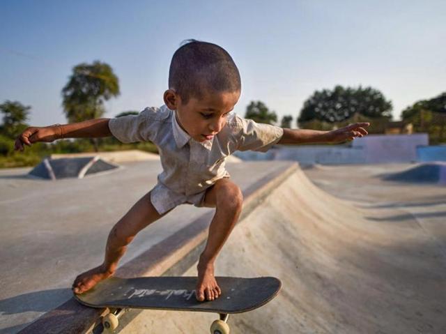 A child practises skating moves at India’s first rural skating park, Janwaar Park. Children in this village get to use skate boards provided they don’t bunk school. (Pratik Chorge / HT Photo) A child practises skating moves at India’s first rural skating park, Janwaar Park. Children in this village get to use skate boards provided they don’t bunk school. (Pratik Chorge / HT Photo)