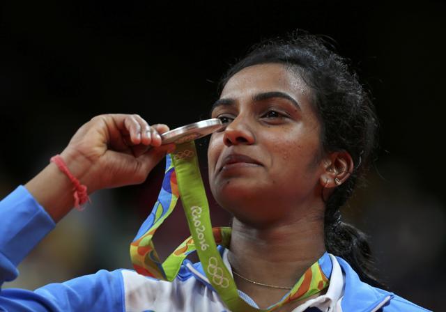PV Sindhu poses with her silver medal at the Rio Olympics. (REUTERS) PV Sindhu poses with her silver medal at the Rio Olympics. (REUTERS)