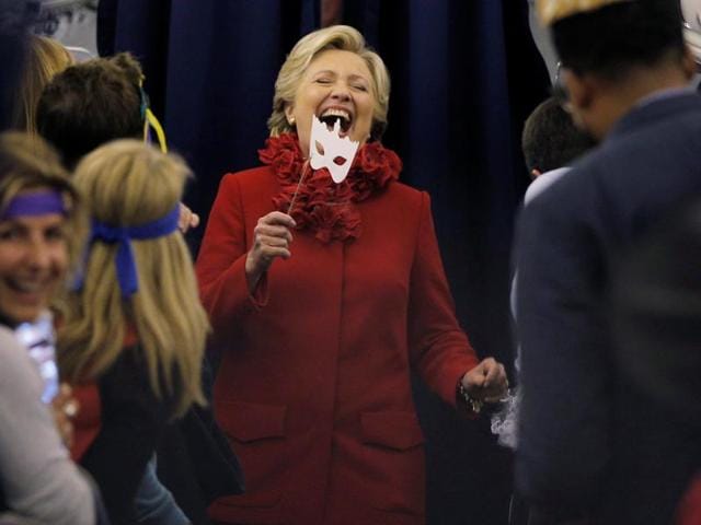 US democratic presidential candidate Hillary Clinton holds a Halloween mask during her campaign in Erlanger, Kentucky on October 31, 2016. (Reuters) US democratic presidential candidate Hillary Clinton holds a Halloween mask during her campaign in Erlanger, Kentucky on October 31, 2016. (Reuters)