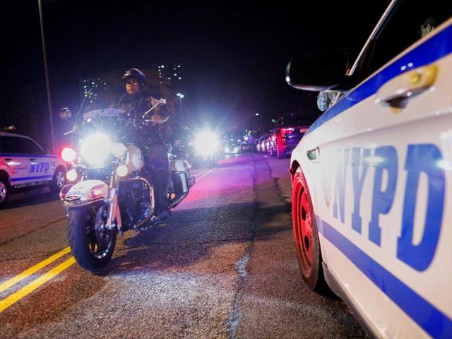 New York Police officers take part in a procession carrying the body of Sergeant Paul Tuozzolo, who was fatally shot in a shootout, at the Jacobi Medical Center in Bronx, New York. (Reuters Photo)
