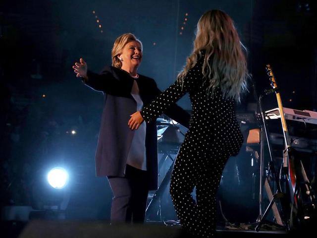 Democratic presidential nominee former Secretary of State Hillary Clinton greets recording artist Beyonce during a Get Out The Vote concert at Wolstein Center on November 4, 2016 in Cleveland, Ohio. (AFP) Democratic presidential nominee former Secretary of State Hillary Clinton greets recording artist Beyonce during a Get Out The Vote concert at Wolstein Center on November 4, 2016 in Cleveland, Ohio. (AFP)