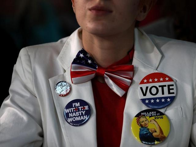 A supporter looks on as Democratic presidential nominee former Secretary of State Hillary Clinton speaks during a campaign rally at Eastern Market on November 4, 2016 in Detroit, Michigan. (AFP) A supporter looks on as Democratic presidential nominee former Secretary of State Hillary Clinton speaks during a campaign rally at Eastern Market on November 4, 2016 in Detroit, Michigan. (AFP)