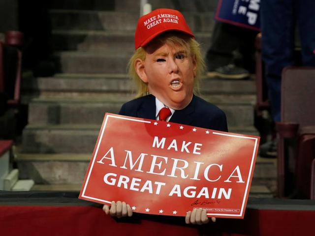 A child dressed up as Republican presidential nominee Donald Trump waits at a campaign event in Hershey, Pennsylvania. (REUTERS) A child dressed up as Republican presidential nominee Donald Trump waits at a campaign event in Hershey, Pennsylvania. (REUTERS)