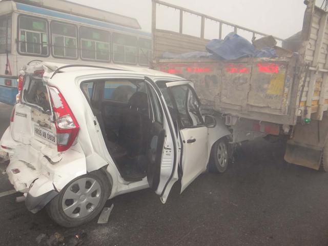 At least 30 vehicles collided at two locations due to the dense smog on NH-1, according to the police.  (HT Photo)