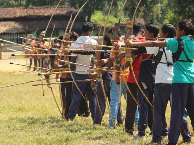 Tribal children at a practice session in Shivtarai village. With 94 medals at state and national events, they now aim for international fame.(Ritesh Mishra/ HT PHOTO)