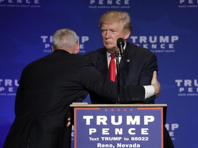 Members of the Secret Service rush Republican presidential candidate Donald Trump off the stage at a campaign rally in Reno, Nevada. (AP Photo) Members of the Secret Service rush Republican presidential candidate Donald Trump off the stage at a campaign rally in Reno, Nevada. (AP Photo)