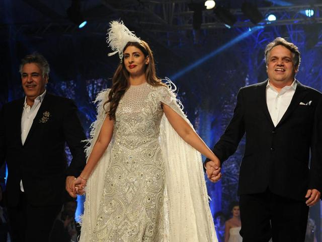 Shweta with Abu Jani (L) and Sandeep Khosla at the launch of their new international line in association with Volvo S90 in Mumbai on Friday. (AFP) 
