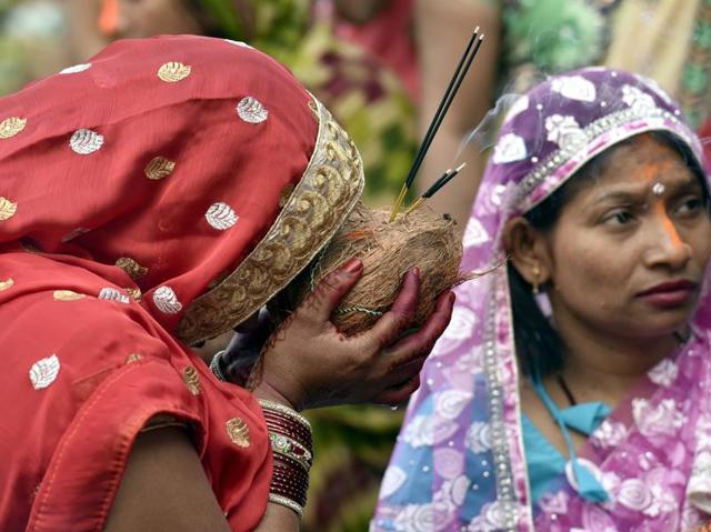 A woman offering prayers at Durgiana temple in Amritsar on Sunday. (Gurpreet Singh/HT Photo)