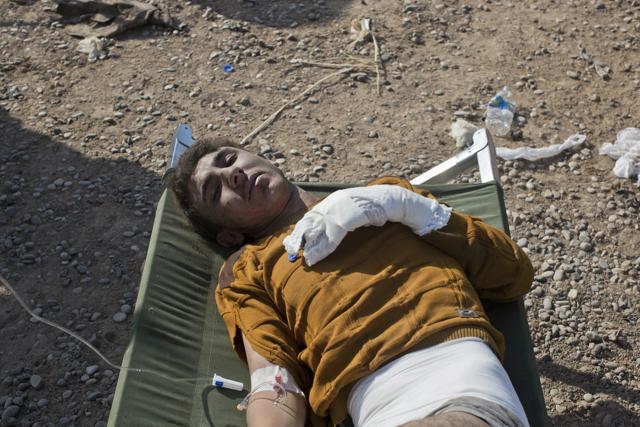 A man injured in fighting between the Iraqi forces and Islamic State militants gets treatment at a field hospital in Gogjali, on the eastern edge of Mosul, Iraq. (AP) A man injured in fighting between the Iraqi forces and Islamic State militants gets treatment at a field hospital in Gogjali, on the eastern edge of Mosul, Iraq. (AP)