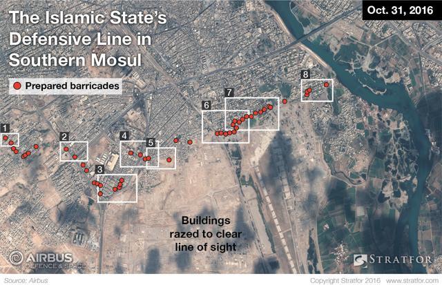 Satellite image show that Islamic State militants in Mosul have set up rows of concrete barricades, earthen berms and rubble to bog down advancing forces. (AP Photo)